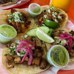 Pork belly tacos and Al pastor tacos Pork belly tacos and Al pastor tacos