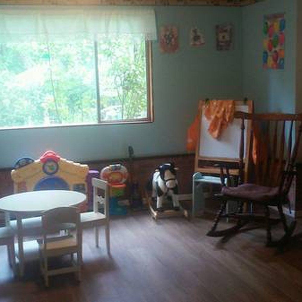 Eric's Place - Art easel, rocking chair, rocking horse and door toy. - Child Care & Day Care Near Me - Kenmore, Washington Eric's Place - Art easel, rocking chair, rocking horse and door toy. - Child Care & Day Care Near Me - Kenmore, Washington