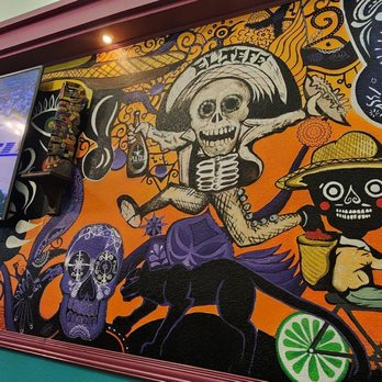 Zona Rosa Mexican Grill - a colorful mural of a skeleton riding a bike - Mexican Near Me - San Francisco, California Zona Rosa Mexican Grill - a colorful mural of a skeleton riding a bike - Mexican Near Me - San Francisco, California