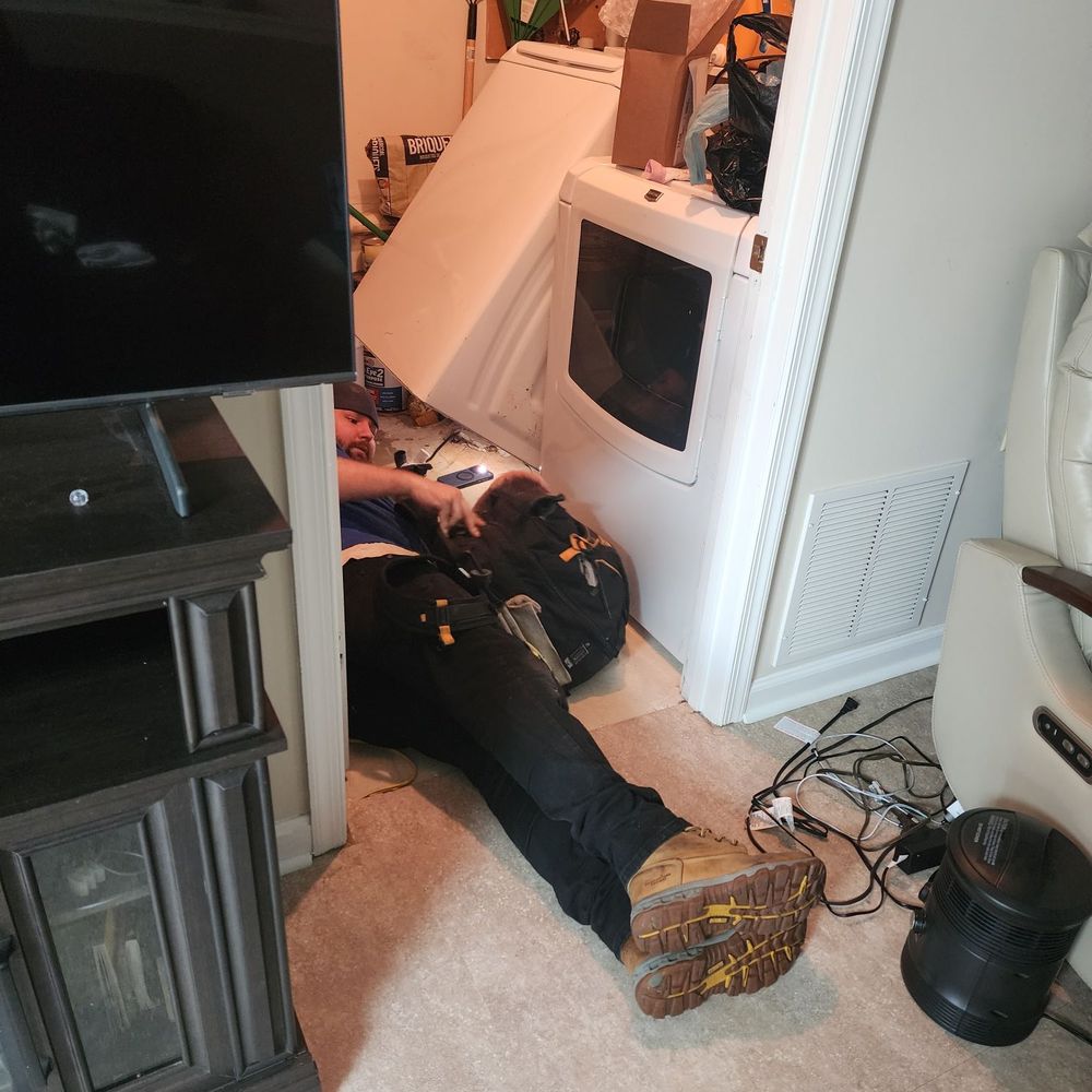 Constellation Home - Tech servicing washer - Electricians Near Me - Middle River, Maryland Constellation Home - Tech servicing washer - Electricians Near Me - Middle River, Maryland