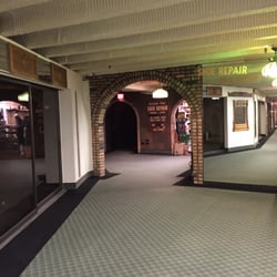 Highland Park Shoe Repair - You will find the downstairs at the end of a hallway.