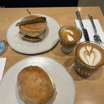 Nemesis Coffee - Cortado, Latte, and two sandwiches - Bakeries Near Me - North Vancouver, British Columbia Nemesis Coffee - Cortado, Latte, and two sandwiches - Bakeries Near Me - North Vancouver, British Columbia