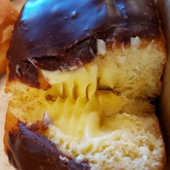 Donut Inn - Part of a long chocolate donut with Bavarian cream filling - Donuts Near Me - Wilmington, North Carolina Donut Inn - Part of a long chocolate donut with Bavarian cream filling - Donuts Near Me - Wilmington, North Carolina