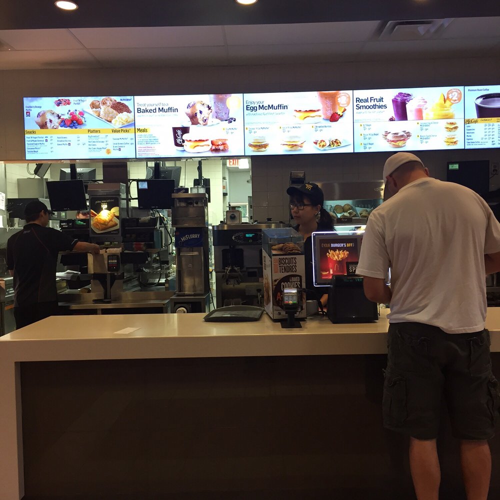 a man standing in front of the counter a man standing in front of the counter