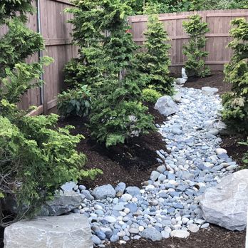Luong's Landscaping - Dry creek bed, boulders, evergreen trees, and shrubs. - Landscaping Near Me Luong's Landscaping - Dry creek bed, boulders, evergreen trees, and shrubs. - Landscaping Near Me