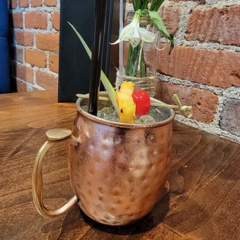 Captains Grill - Upland - Grilled pineapple mule. - Seafood Near Me - Upland, California