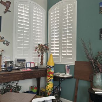 Prestige Interiors - Two living room corner windows with wood shutters - Shades & Blinds Near Me Prestige Interiors - Two living room corner windows with wood shutters - Shades & Blinds Near Me