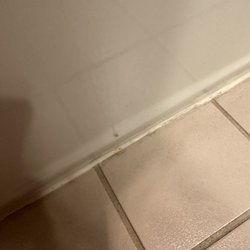 Clock Tower Inn - Brown spots on bottom of tub sharing one photo (4 drip spots across the outside.