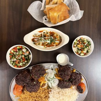Rumi Kabob House - The Spread Pictured: Chapli Kabab Combo Platter, Mantu Appetizer - Afghan Near Me - Manchester, New Hampshire Rumi Kabob House - The Spread Pictured: Chapli Kabab Combo Platter, Mantu Appetizer - Afghan Near Me - Manchester, New Hampshire