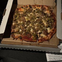 10 inch thin crust with sausage, mushrooms and Greek olives.