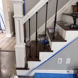 Extreme Equity Construction - New stair case treads and spindles and trim 
Opened up the stair case for a  more open feel