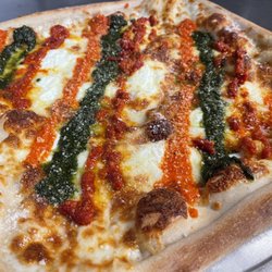 Panzone's Pizza - Triple Threat Special.
Roasted Red Pepper, Sundried Tomato, and a Basil Pesto with Ricotta cheese!!!
