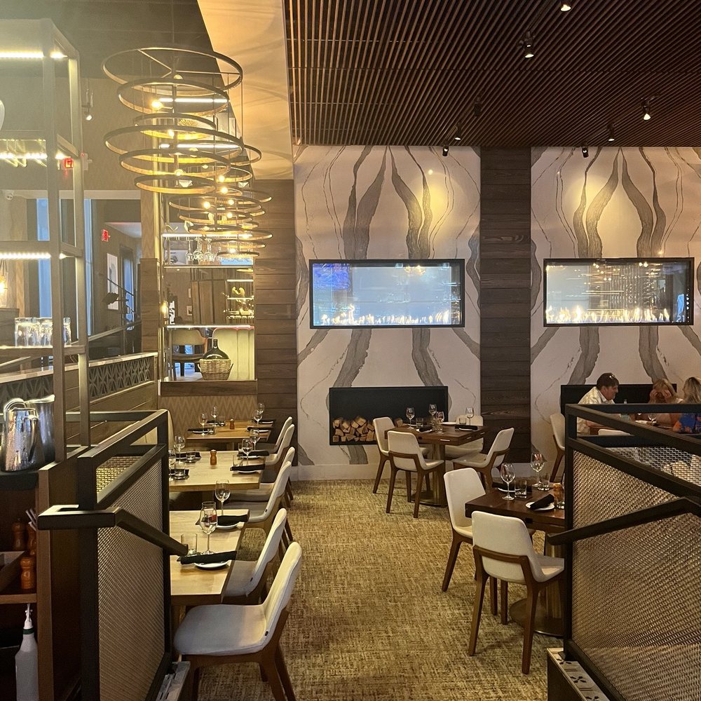 Cuts Steakhouse - Lounge is behind the fireplace. Ask about it - Steakhouses Near Me - Suwanee, Georgia