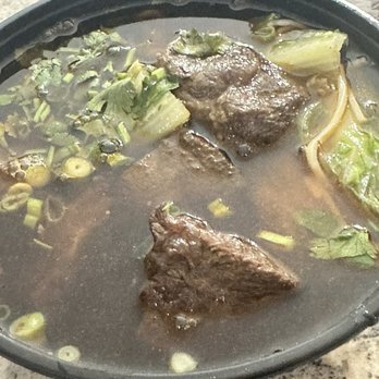 Steam Boys - Beef Noodle both after broth is added - Pan Asian Near Me - Madison, Alabama