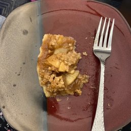 a piece of apple pie on a plate with a fork a piece of apple pie on a plate with a fork