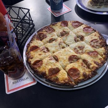 Blue Collar Bar & Grill - Barside table. - Pizza Near Me - Green Bay, Wisconsin Blue Collar Bar & Grill - Barside table. - Pizza Near Me - Green Bay, Wisconsin