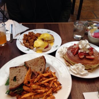 Le Petit Café - Eggs Benedict, Rib Eye Steak Panini, and short stack of Banana, Walnut, Pecan Pancakes with whip cream and strawberries on top - Coffee & Tea Near Me - Brooklyn, New York
