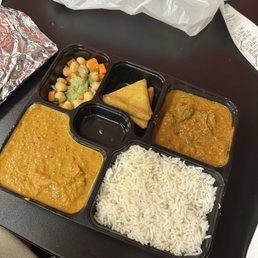 Butter chicken, lamb curry, chicken samosas, rice and salad Butter chicken, lamb curry, chicken samosas, rice and salad