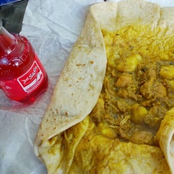 Trinidad Roti Shop Carribean Cusine - Curried Chicken Dhalpuri Roti with a "Red Solo"