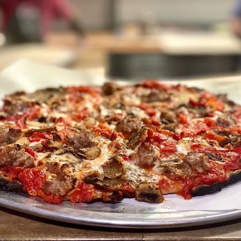 Fuoco Apizza - a close up of a pizza - Pizza Near Me - Cheshire, Connecticut