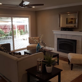 JW Construction - a living room with a fireplace - General Contractors Near Me