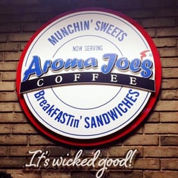 a sign on a brick wall a sign on a brick wall