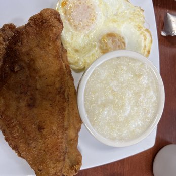 Sarom's Southern Kitchen - Eggs over medium with Grits and 2 piece Cat Fish - Southern Near Me - Elk Grove, California Sarom's Southern Kitchen - Eggs over medium with Grits and 2 piece Cat Fish - Southern Near Me - Elk Grove, California