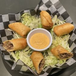 Chris Doughs Pizzeria & Bar - Famously made in house cheesesteak eggrolls