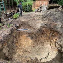 Affordable Septic & Excavating - This is the hole. After it was dug, it rained again and they had to pump out the water.