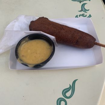 Little Red Wagon - Corn dog with tomatillo cheese dipping sauce, picture in shade - Hot Dogs Near Me - Anaheim, California Little Red Wagon - Corn dog with tomatillo cheese dipping sauce, picture in shade - Hot Dogs Near Me - Anaheim, California