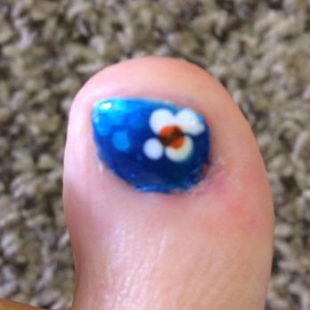 Myle at The Nail Studio - Photo shows error of flower placement and instead of removing and starting over she just applied another coat of paint. - Nail Technicians Near Me - Santa Rosa, California Myle at The Nail Studio - Photo shows error of flower placement and instead of removing and starting over she just applied another coat of paint. - Nail Technicians Near Me - Santa Rosa, California