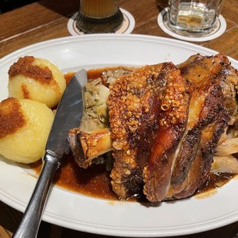 Münchner Stubn - 1/2 Pork Knuckle with potato dumplings & cabbage - Bavarian Near Me - Munich, BY