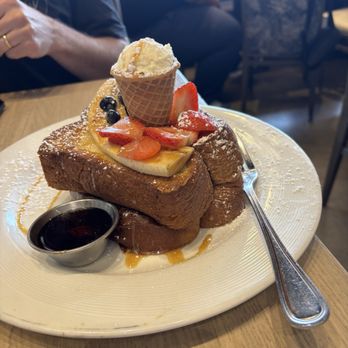 Hash Kitchen - Banana Split French toast. The bananas are candied and the "ice cream cone" is filled with mascarpone. The fruit was high quality. - Breakfast & Brunch Near Me - Chandler, Arizona Hash Kitchen - Banana Split French toast. The bananas are candied and the "ice cream cone" is filled with mascarpone. The fruit was high quality. - Breakfast & Brunch Near Me - Chandler, Arizona