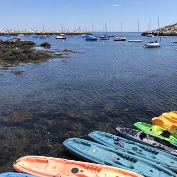 Delisi’s Red Skiff - a row of kayaks in the water - Seafood Near Me - Rockport, Massachusetts Delisi’s Red Skiff - a row of kayaks in the water - Seafood Near Me - Rockport, Massachusetts
