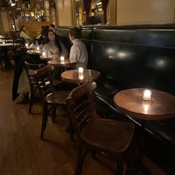 Bar Six - Lighted tables in the bar area. - French Near Me - New York, New York