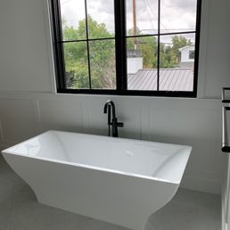 a bathtub in a bathroom a bathtub in a bathroom