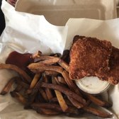 Photo of Barefoot Beach Cafe - Honolulu, HI, United States. Chicken strips and burnt fries- $12
