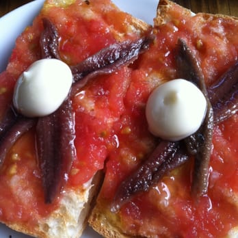 Toro - Pan con Tomate - toasted bread with tomatoes, marinated anchovies. Very fresh and savory. - Tapas Bars Near Me - Boston, Massachusetts Toro - Pan con Tomate - toasted bread with tomatoes, marinated anchovies. Very fresh and savory. - Tapas Bars Near Me - Boston, Massachusetts