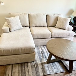 Bonaterra II Sand Sofa with reversible chaise and Lakeland Brown coffee table