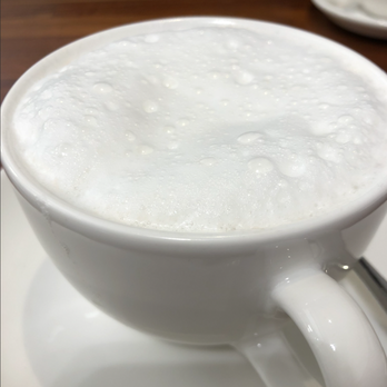 Cannelle - Those big bubbles represent a steaming wand that got the better of a barista, and produce a drink that is far less enjoyable to sip. - Coffee & Tea Near Me - Ann Arbor, Michigan