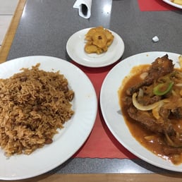 The biggest portion of chicken with sauce and rice and beans I've ever had. Even came with fried plantains. Only $10 for this large portion The biggest portion of chicken with sauce and rice and beans I've ever had. Even came with fried plantains. Only $10 for this large portion