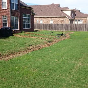 Integrity Landscape and Design - a back yard with a fenced in area - Landscaping Near Me - Arlington, Tennessee Integrity Landscape and Design - a back yard with a fenced in area - Landscaping Near Me - Arlington, Tennessee
