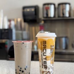 Tieguanyin oolong milk tea with boba and king of mango smoothie Tieguanyin oolong milk tea with boba and king of mango smoothie