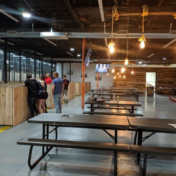 LumberjAxes Axe Throwing - Tempe - The tables they provide behind the lane to relax - Axe Throwing Near Me - Tempe, Arizona