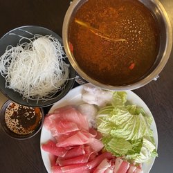 Asian Hot Pot - 4 meats, 1 Chinese cabbage and glass noodles, with a spicy Szechuan broth. Delicious.  $15 lunch menu