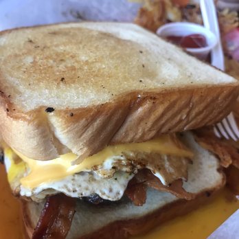 Showdown - a bacon, egg, and cheese sandwich in a basket - Dive Bars Near Me - San Marcos, Texas