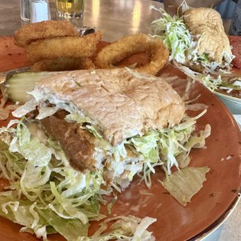 Septembers Taproom & Eatery - Crispy Fish Sandwich w/ Onion Rings. A hot, messy, crispy goodness. - Sports Bars Near Me - Perris, California Septembers Taproom & Eatery - Crispy Fish Sandwich w/ Onion Rings. A hot, messy, crispy goodness. - Sports Bars Near Me - Perris, California