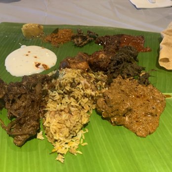 Arusuvai Chettinad - a plate of food on a banana leaf - Indian Near Me - North Brunswick, New Jersey Arusuvai Chettinad - a plate of food on a banana leaf - Indian Near Me - North Brunswick, New Jersey