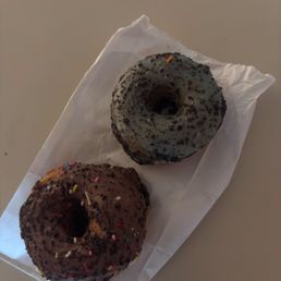 Chocolate-iced donut and cookies and creme iced donut. Chocolate-iced donut and cookies and creme iced donut.
