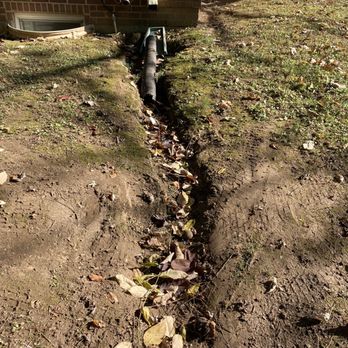 Quality Grading - The downspout!!!  It was horrible! - Lawn Services Near Me